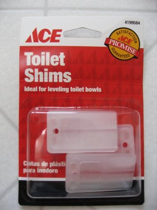 Use shims to level the toilet as needed